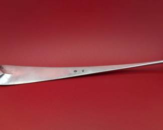 Heavy silver soup ladle