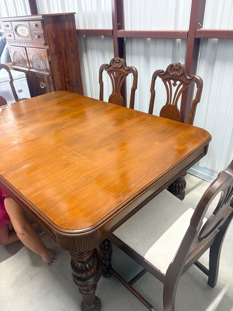Antique Jacobean Revival dining room set featuring extension table and 6 chairs