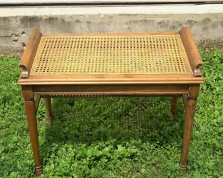 Wooden cane bench measures 25" x 15" x 20"