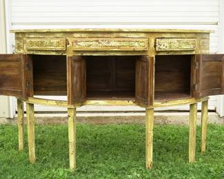Earth-tone distressed half-moon credenza measures 62 5/8" x 23" x 40"