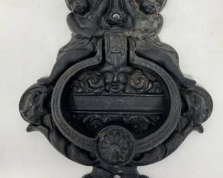 115 VintageCastIronNorthWindDoorKnocker