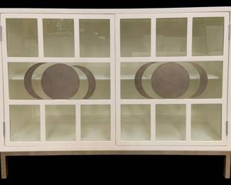 324 - Chelsea House Ficino Bookshelf White (Description): 36 x 48 x 18, Retail $3770, An excellent use for storage that doesn t take up a lot of room, the Ficino Bookshelf is perfect for those who need style with a statement. Finished in white with a metal frame, the moon phase detailing on the windowpane glass doors adds an enduring touch to a polished look. Designed by Lisa Kahn.