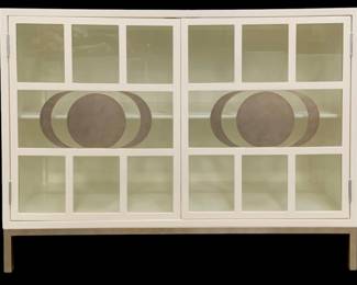 337 - Chelsea House Ficino Bookshelf White (Description): 36 x 48 x 18, Retail $3770, An excellent use for storage that doesn t take up a lot of room, the Ficino Bookshelf is perfect for those who need style with a statement. Finished in white with a metal frame, the moon phase detailing on the windowpane glass doors adds an enduring touch to a polished look. Designed by Lisa Kahn.