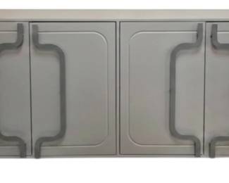 9502 - Elk Home Brady 4 Door Credenza (Description): 31 x 70 x 16, The Brady 4-Door Credenza is a wood painted storage cabinet with a washed denim painted finish and laser cut steel hardware that extends from top to bottom of each door in a curving pattern. The credenza includes a fixed shelf behind each of the four doors and interior cord management, offering ample storage for a living room or dining room.