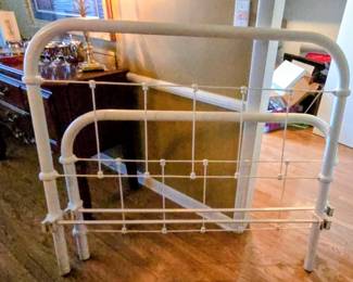 Antique white wrought iron spindle bed