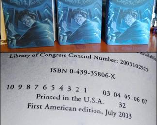 Three hardback Harry Potter Order of the Phoenix hard back books new condition first American Edition July 2003