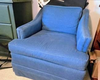 Super comfortable navy arm chair. Black Phoebe branded bag specialized storage organizer sports gear or golf accessories.