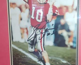 Georgia Bulldogs quarterback Eric Zeier, featuring his signature across the center.