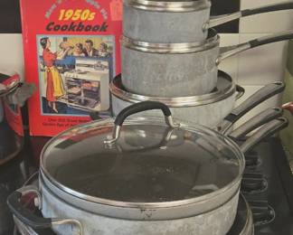 Large set of Calphalon cookware ( worn on the outside -good on the inside)