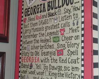 decorative sign honoring University of Georgia Bulldog traditions, featuring classic Larry Munson quotes and game-day rituals