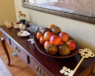 Faux fruit, decor items, entry table, framed prints