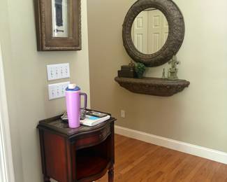 Small table, mirror, framed art