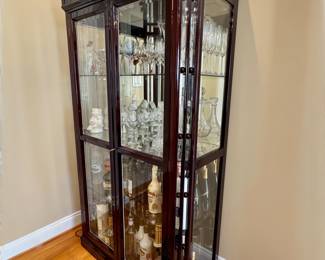 Lighted glass display cabinet with mirrored backing