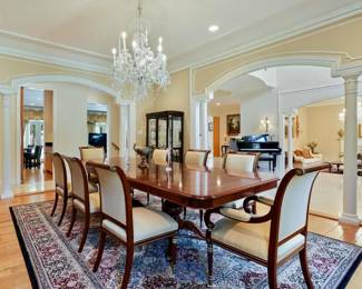 Double pedestal dining table with one leaf and table pads