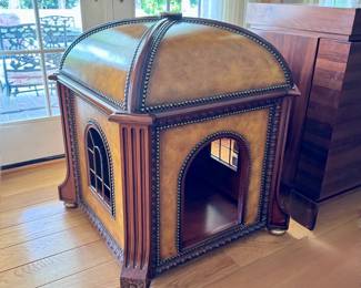 Maitland-Smith doghouse with fine leather upholstery, brass accents and carved wood detail