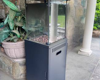 Glass enclosed black steel propane patio heater with fire column