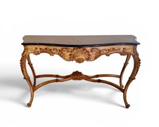 Ornately carved oak table finished with gold detail and black marble top (with slight crack)