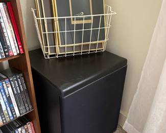 Black Upholstered Storage Ottoman with Gold Picture Frames
