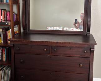 Antique wooden dresser with mirror. Has wooden see n wheels! 