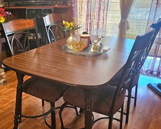 vintage dining room, table is wood, chairs are metal