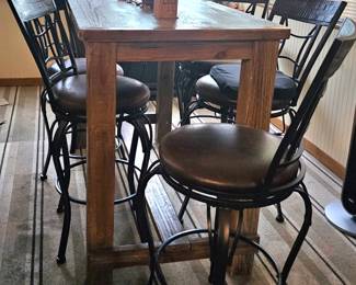 Pub style narrow table and bar stools