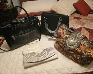 lots of great purses, one is a wine purse