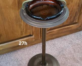 Amber glass insert in a metal smoking stand