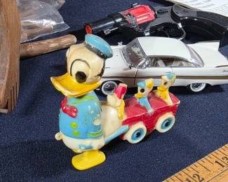 Donald Duck toy, toy car, cap gun and other wooden toys