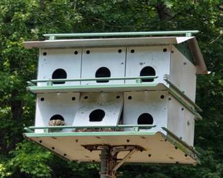 Metal purple martin house on industrial pole