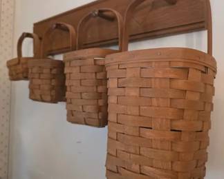 Graduated size Longaberger baskets with peg wall rack