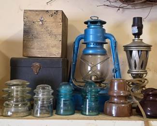 Vintage phone line insulators and lantern