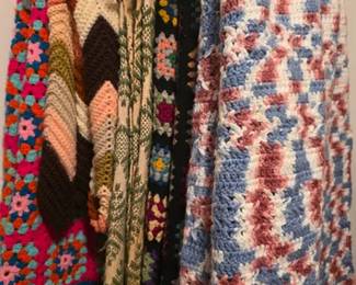 Collection of vintage knit and crocheted throws or afghans, most handmade