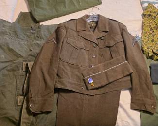 Korean War-era uniforms, hats and duffle bags