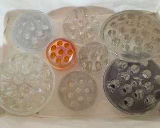 Assortment of glass flower frogs
