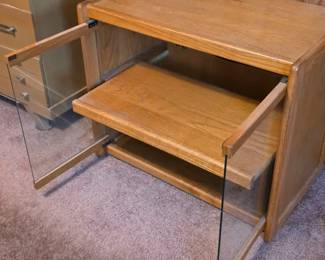 Media cabinet with pull out shelf and glass doors