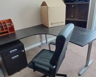 L shape office desk and has upper stands, office chair, 2nd of office filing cabinet
