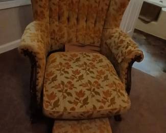 Wing back chair with foot rest, bottom in chair is weak