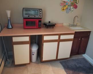 Kitchen cabinets - not connected to wall. Microwave oven; toaster oven
