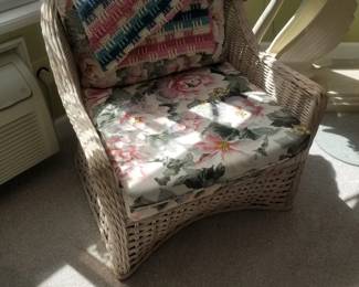 Lovely rattan chair with floral cushions