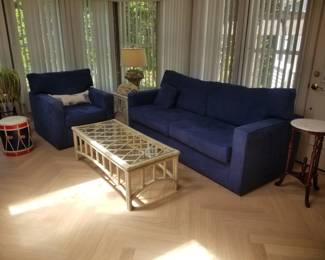 Blue suede-like couch & oversize chair; rattan & glass coffee table