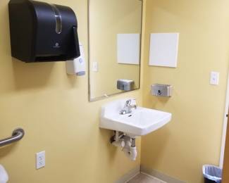 Paper towel dispenser; commercial mirror; sink