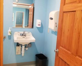 Sink; soap dispenser; paper towel dispenser