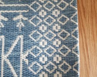 All-weather rug is approximately 9' x 6 1/2'