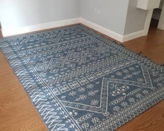 All-weather rug is approximately 9' x 6 1/2'