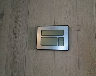 Needs batteries, but it is a clock and thermometer all in one