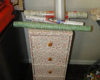 Because, you know, contact paper is good for covering a storage drawer