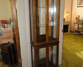 Tall mirror backed glass sides and front curio cabinet