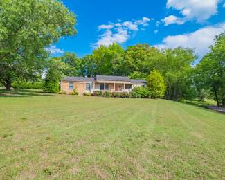 Nestled on approx. 1.6 Acres, this 3 bedroom 1.5 bath brick home offers 1968 +-SF