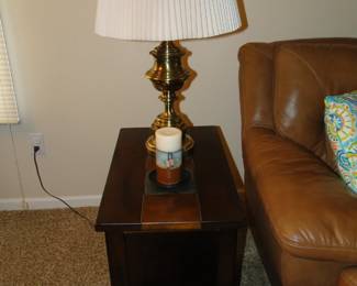 This is the side table and lamp. On the side of the leather sofa