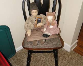 Educator doll and pupil doll, on a very nice statement chair